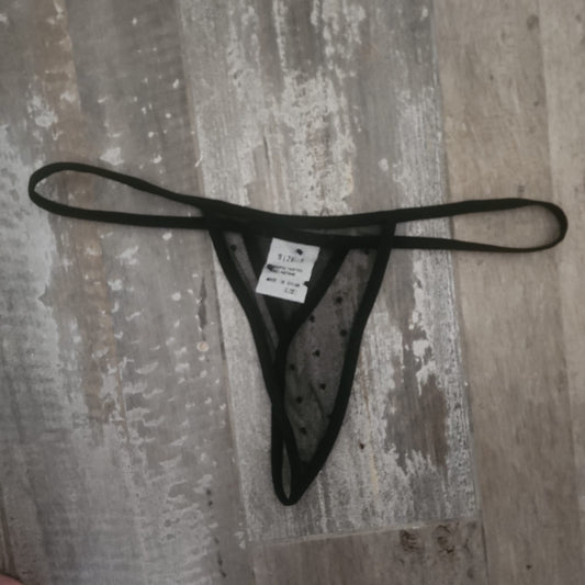 Pantie negra semitransparente con puntos negros